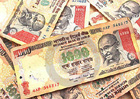 Rupee tumbles to 55.44 against dollar